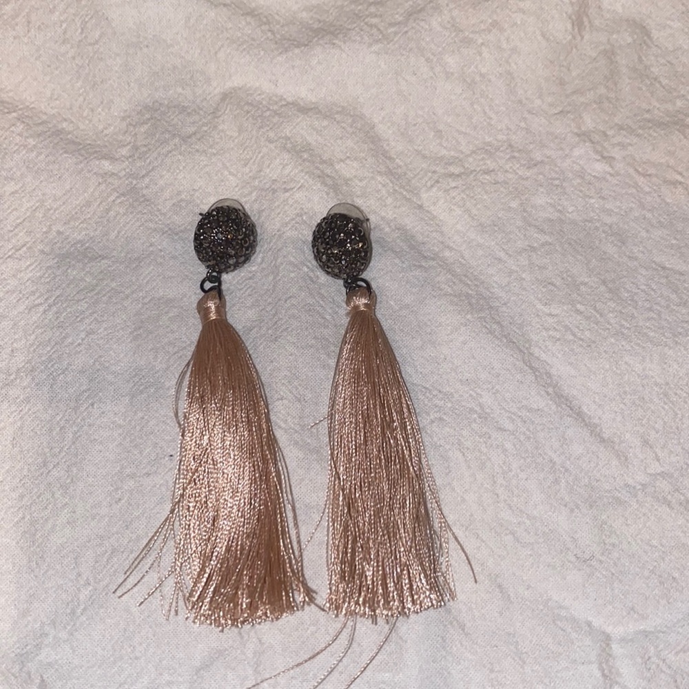 Women’s pierced earrings. Silver and rhinestone top with pink silky tassel.